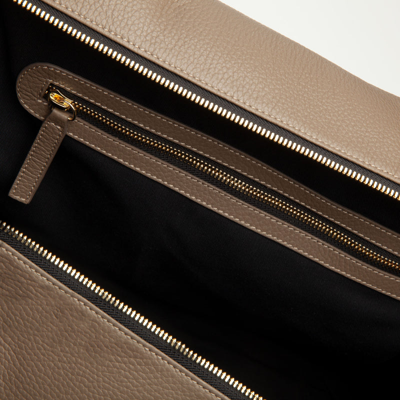 Taupe Weekend Travel Bag made of Italian leather with gold hardware. Dimension: 18.5" L x 11.5" H x 8.5" D. Made in Spain